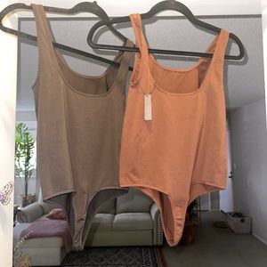 2 Skims Scoop Neck BodySuits.Size small. Colors: Oxide (med.brown) & Coco (dark)